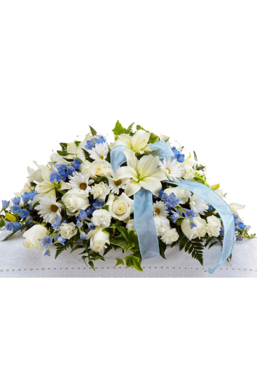 funeral flowers casket spray blue and white